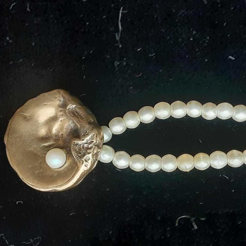 pearl necklace with gold oyster shell